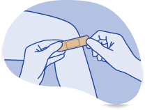 Placing a Band-Aid® Brand Adhesive bandage on a wound.